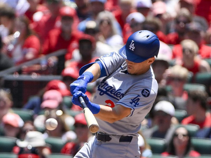 Jun 8, 2025; St. Louis, Missouri, USA;  Los Angeles Dodgers second baseman Tommy Edman (25) hits a one run single against the St. Louis Cardinals during the second inning at Busch Stadium. Mandatory Credit: Jeff Curry-Imagn Images
