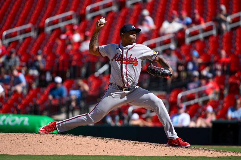 Jun 26, 2024; St. Louis, Missouri, USA;  Atlanta Braves relief pitcher Raisel Iglesias (26) pitches against the St. Louis Cardinals during the ninth inning at Busch Stadium. Mandatory Credit: Jeff Curry-USA TODAY Sports