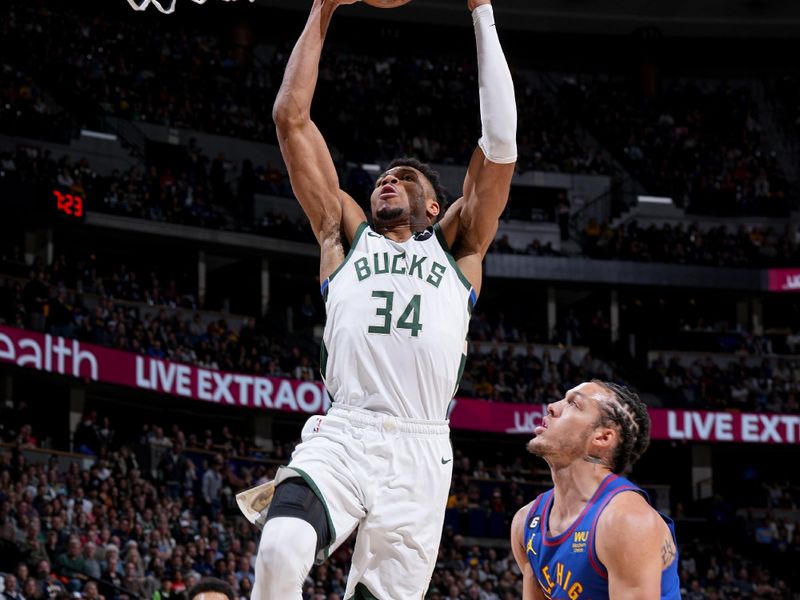 DENVER, CO - MARCH 25: Giannis Antetokounmpo #34 of the Milwaukee Bucks drives to the basket during the game against the Denver Nuggets on March 25, 2023 at the Ball Arena in Denver, Colorado. NOTE TO USER: User expressly acknowledges and agrees that, by downloading and/or using this Photograph, user is consenting to the terms and conditions of the Getty Images License Agreement. Mandatory Copyright Notice: Copyright 2023 NBAE (Photo by Garrett Ellwood/NBAE via Getty Images)