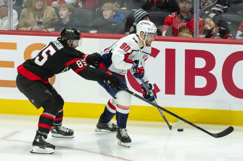 Jan 16, 2025; Ottawa, Ontario, CAN; Ottawa Senators defenseman Jake Batherson (85) chases Washington Capitals left wing Pierrre-Luc Dubois (80) who controls the puck in the third period at the Canadian Tire Centre. Mandatory Credit: Marc DesRosiers-Imagn Images