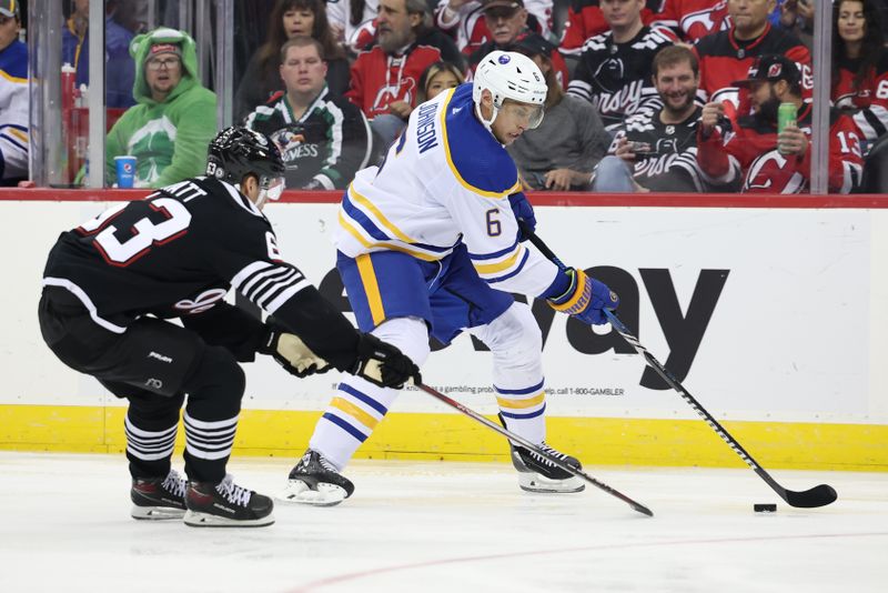 Oct 27, 2023; Newark, New Jersey, USA; Buffalo Sabres defenseman Erik Johnson (6) carries the puck as New Jersey Devils left wing Jesper Bratt (63) defends during the second period at Prudential Center. Mandatory Credit: Vincent Carchietta-USA TODAY Sports