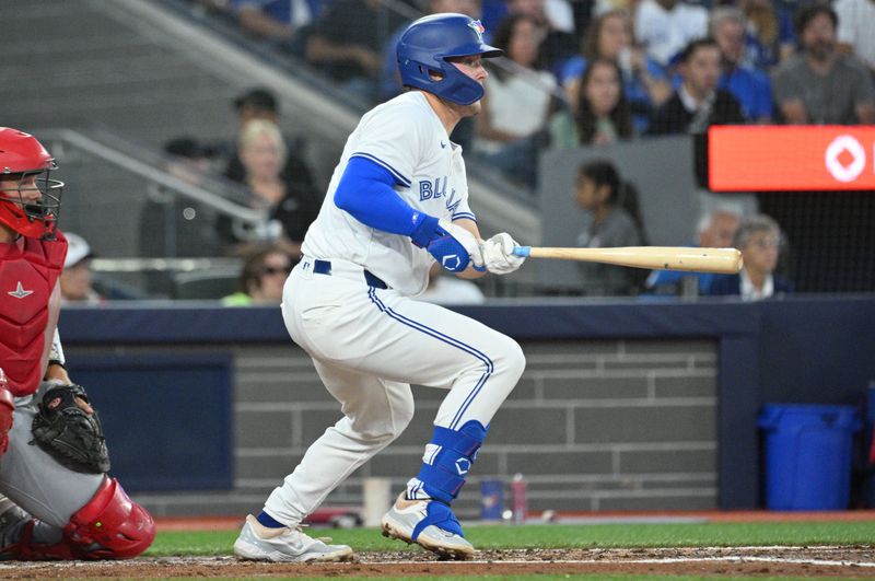 Aug 22, 2024; Toronto, Ontario, CAN;  Toronto Blue Jays second baseman Will Wagner (7) hits a single against the Los Angeles Angels in the second inning at Rogers Centre. Mandatory Credit: Dan Hamilton-USA TODAY Sports