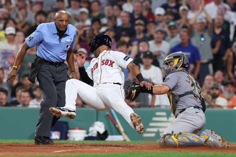 Jul 10, 2024; Boston, Massachusetts, USA; Oakland Athletics catcher Shea Langeliers (23) tags out Boston Red Sox second baseman Jamie Westbrook (73) during the fifth inning at Fenway Park. Mandatory Credit: Paul Rutherford-USA TODAY Sports