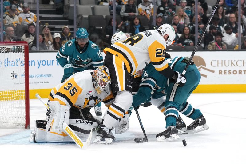 Nov 4, 2023; San Jose, California, USA; Pittsburgh Penguins defenseman Marcus Pettersson (28) collides with goaltender Tristan Jarry (35) during the second period against the San Jose Sharks at SAP Center at San Jose. Mandatory Credit: Darren Yamashita-USA TODAY Sports