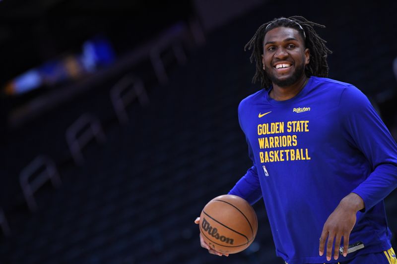 SAN FRANCISCO, CA - APRIL 14: Kevon Looney #5 of the Golden State Warriors smiles before the game against the Utah Jazz on April 14, 2024 at Chase Center in San Francisco, California. NOTE TO USER: User expressly acknowledges and agrees that, by downloading and or using this photograph, user is consenting to the terms and conditions of Getty Images License Agreement. Mandatory Copyright Notice: Copyright 2024 NBAE (Photo by Noah Graham/NBAE via Getty Images)