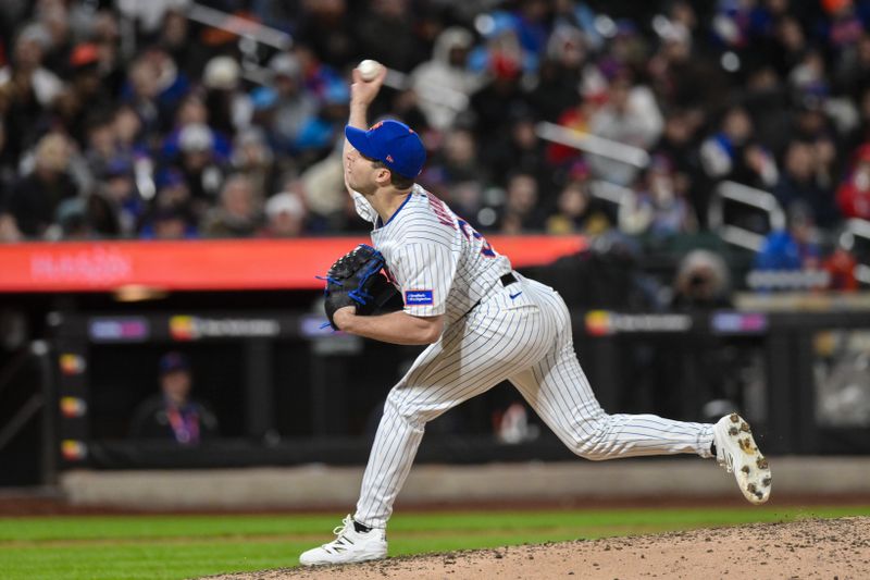 Apr 21, 2025; New York City, New York, USA; New York Mets pitcher Max Kranick (32) pitches against the Philadelphia Phillies during the seventh inning at Citi Field. Mandatory Credit: John Jones-Imagn Images