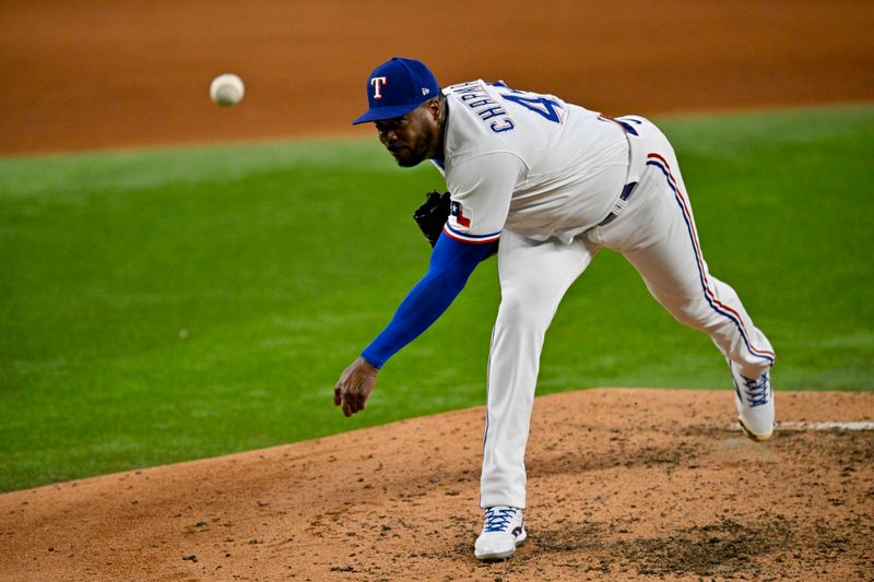 Aug 3, 2023; Arlington, Texas, USA; Texas Rangers relief pitcher Aroldis Chapman (45) pitches against the Chicago White Sox during the eighth inning at Globe Life Field. Mandatory Credit: Jerome Miron-USA TODAY Sports