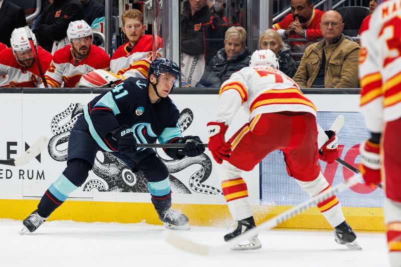 Oct 19, 2024; Seattle, Washington, USA; Seattle Kraken defenseman Ryker Evans (41) defends against Calgary Flames center Martin Pospisil (76) during the third period at Climate Pledge Arena. Mandatory Credit: Caean Couto-Imagn Images