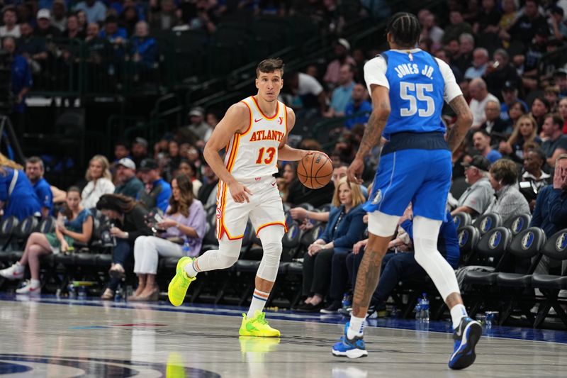 DALLAS, TX - APRIL 4: Bogdan Bogdanovic #13 of the Atlanta Hawks handles the ball during the game on April 4, 2024 at the American Airlines Center in Dallas, Texas. NOTE TO USER: User expressly acknowledges and agrees that, by downloading and or using this photograph, User is consenting to the terms and conditions of the Getty Images License Agreement. Mandatory Copyright Notice: Copyright 2024 NBAE (Photo by Glenn James/NBAE via Getty Images)