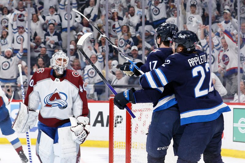 Apr 21, 2024; Winnipeg, Manitoba, CAN; Winnipeg Jets center Mason Appleton (22) celebrates the second period goal by Winnipeg Jets center Adam Lowry (17) on Colorado Avalanche goaltender Alexandar Georgiev (40) in game one of the first round of the 2024 Stanley Cup Playoffs at Canada Life Centre. Mandatory Credit: James Carey Lauder-USA TODAY Sports