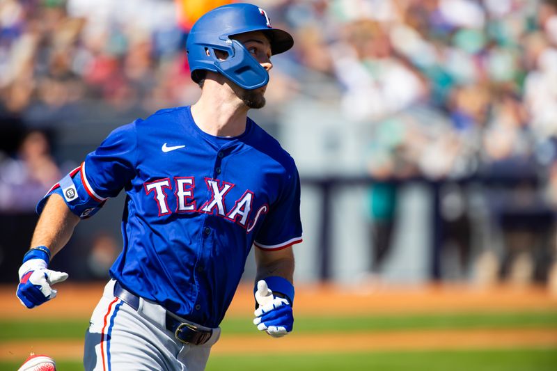 Mar 5, 2024; Peoria, Arizona, USA; Texas Rangers outfielder Evan Carter rounds the bases after hitting a home run against the Seattle Mariners during a spring training baseball game at Peoria Sports Complex. Mandatory Credit: Mark J. Rebilas-USA TODAY Sports