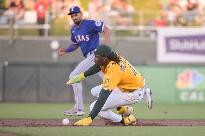 Apr 22, 2025; West Sacramento, California, USA; Athletics outfielder Lawrence Butler (4) attempts to steal second base during the first inning of the game against the Texas Rangers at Sutter Health Park. Mandatory Credit: Ed Szczepanski-Imagn Images