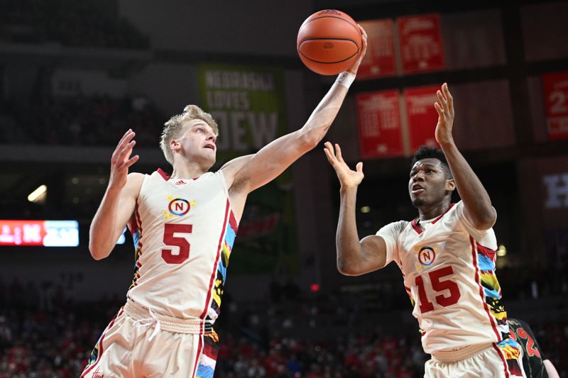 Feb 11, 2023; Lincoln, Nebraska, USA;  Nebraska Cornhuskers guard Sam Griesel (5) grabs a rebound with forward Blaise Keita (15) against the Wisconsin Badgers in the second half at Pinnacle Bank Arena. Mandatory Credit: Steven Branscombe-USA TODAY Sports