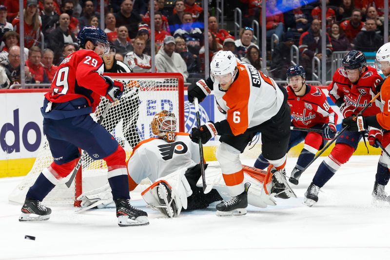 Oct 23, 2024; Washington, District of Columbia, USA; Philadelphia Flyers goaltender Ivan Fedotov (82) makes a save in front of Washington Capitals center Hendrix Lapierre (29) and Flyers defenseman Travis Sanheim (6) in the first period at Capital One Arena. Mandatory Credit: Geoff Burke-Imagn Images