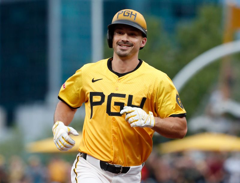 Jul 5, 2024; Pittsburgh, Pennsylvania, USA;  Pittsburgh Pirates designated hitter Bryan Reynolds (10) circles the bases on a two run home run against the New York Mets during the fifth inning at PNC Park. Mandatory Credit: Charles LeClaire-USA TODAY Sports