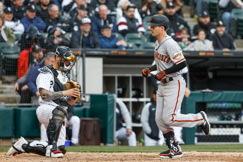 Apr 3, 2023; Chicago, Illinois, USA; San Francisco Giants center fielder Mike Yastrzemski (5) crosses home plate after hitting a solo home run against the Chicago White Sox during the fifth inning at Guaranteed Rate Field. Mandatory Credit: Kamil Krzaczynski-USA TODAY Sports