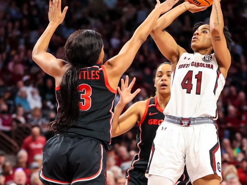 Feb 26, 2023; Columbia, South Carolina, USA; South Carolina Gamecocks guard Kierra Fletcher (41) shoots over Georgia Lady Bulldogs guard Diamond Battles (3) in the first half at Colonial Life Arena. Mandatory Credit: Jeff Blake-USA TODAY Sports