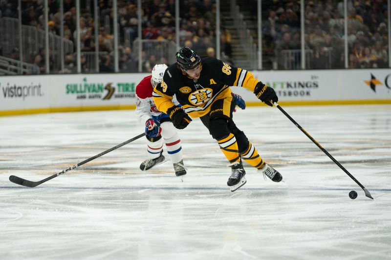 Dec 1, 2024; Boston, Massachusetts, USA; Boston Bruins right wing David Pastrnak (88) skates down the ice against the Montreal Canadiens during the third period of a game at the TD Garden. Mandatory Credit: Natalie Reid-Imagn Images