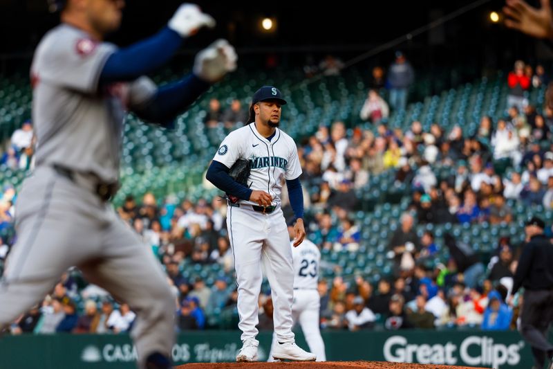 May 28, 2024; Seattle, Washington, USA; Seattle Mariners starting pitcher Luis Castillo (58) reacts on the mound after surrendering a two-run home run to Houston Astros third baseman Alex Bregman (2, left) during the fourth inning at T-Mobile Park. Mandatory Credit: Joe Nicholson-USA TODAY Sports