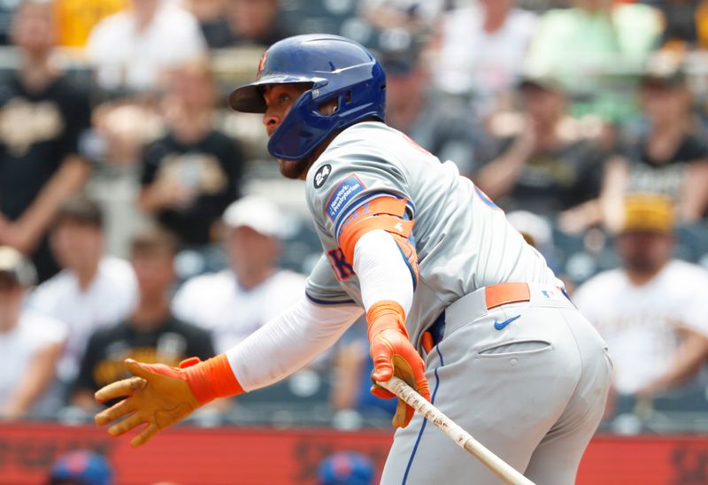 Jul 8, 2024; Pittsburgh, Pennsylvania, USA;  New York Mets designated hitter Francisco Alvarez (4) hits a single against the Pittsburgh Pirates during the eighth inning at PNC Park.  The Pirates won 8-2. Mandatory Credit: Charles LeClaire-USA TODAY Sports