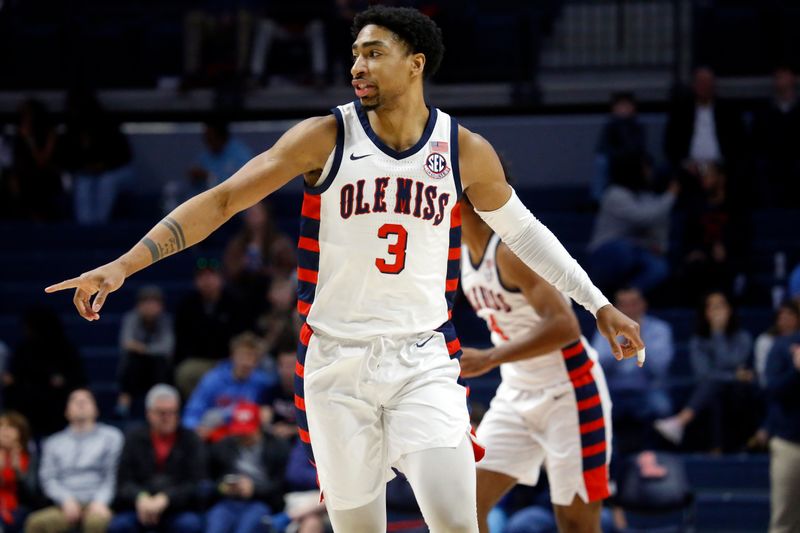 Feb 18, 2023; Oxford, Mississippi, USA; Mississippi Rebels forward Myles Burns (3) reacts after a basket during the first half against the Mississippi State Bulldogs at The Sandy and John Black Pavilion at Ole Miss. Mandatory Credit: Petre Thomas-USA TODAY Sports