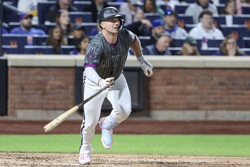 May 24, 2025; New York City, New York, USA;  New York Mets first baseman Pete Alonso (20) hits a single in the seventh inning against the Los Angeles Dodgers at Citi Field. Mandatory Credit: Wendell Cruz-Imagn Images