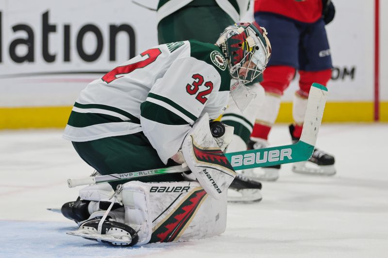 Oct 22, 2024; Sunrise, Florida, USA; Minnesota Wild goaltender Filip Gustavsson (32) makes a save against the Florida Panthers during the second period at Amerant Bank Arena. Mandatory Credit: Sam Navarro-Imagn Images