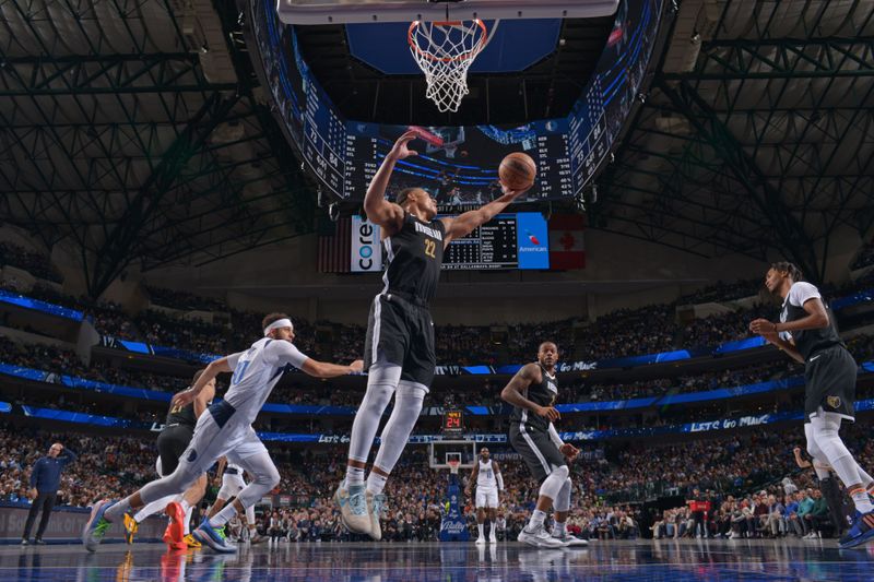 DALLAS, TX - JANUARY 9: Desmond Bane #22 of the Memphis Grizzlies grabs a rebound during the game against the Dallas Mavericks on January 9, 2024 at the American Airlines Center in Dallas, Texas. NOTE TO USER: User expressly acknowledges and agrees that, by downloading and or using this photograph, User is consenting to the terms and conditions of the Getty Images License Agreement. Mandatory Copyright Notice: Copyright 2024 NBAE (Photo by Glenn James/NBAE via Getty Images)