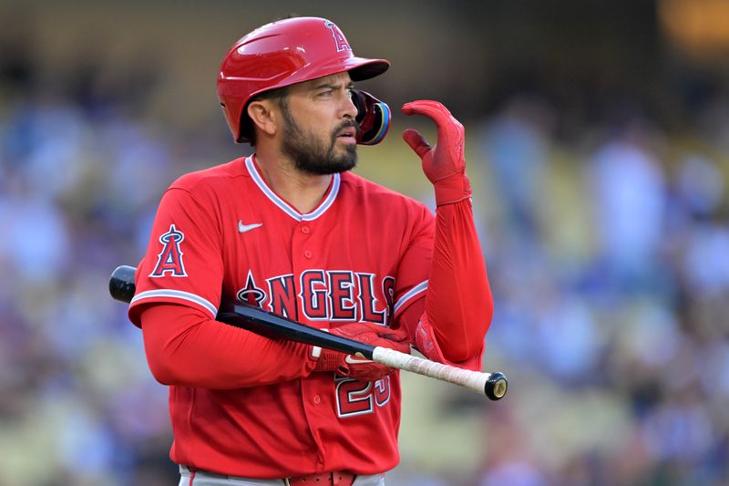 Mar 24, 2026; Los Angeles, California, USA; Los Angeles Angels catcher Travis D'Arnaud (25) returns to the dugout after he was called out on strikes during the second against the Los Angeles Dodgers at Dodger Stadium. Mandatory Credit: Jayne Kamin-Oncea-Imagn Images