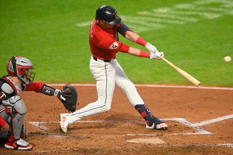 Sep 17, 2024; Cleveland, Ohio, USA; Cleveland Guardians right fielder Lane Thomas (8) hits a solo home run in the fourth inning against the Minnesota Twins at Progressive Field. Mandatory Credit: David Richard-Imagn Images