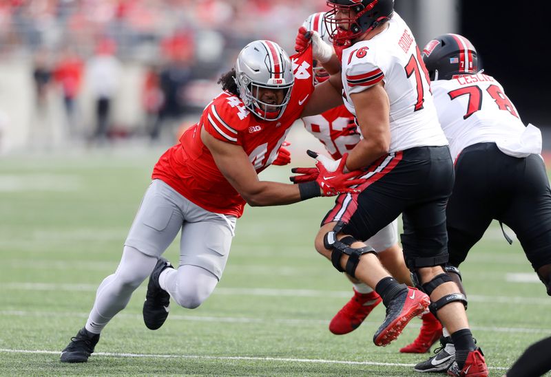 Sep 16, 2023; Columbus, Ohio, USA; Ohio State Buckeyes defensive end JT Tuimoloau (44) rushes the passer as Western Kentucky Hilltoppers offensive lineman Mark Goode (76) blocks during the first quarter at Ohio Stadium. Mandatory Credit: Joseph Maiorana-USA TODAY Sports