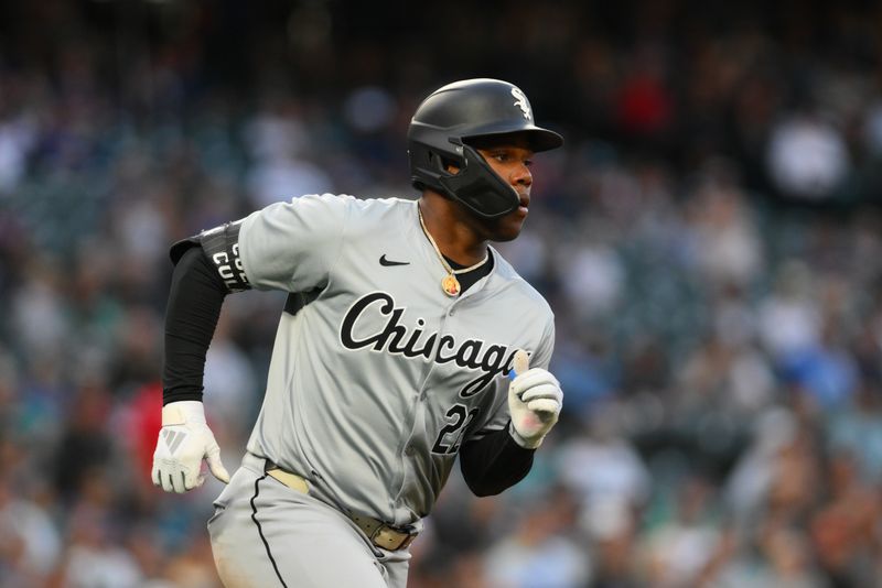 Jun 13, 2024; Seattle, Washington, USA; Chicago White Sox right fielder Oscar Colas (22) runs towards first base after hitting a single against the Seattle Mariners during the ninth inning at T-Mobile Park. Mandatory Credit: Steven Bisig-USA TODAY Sports