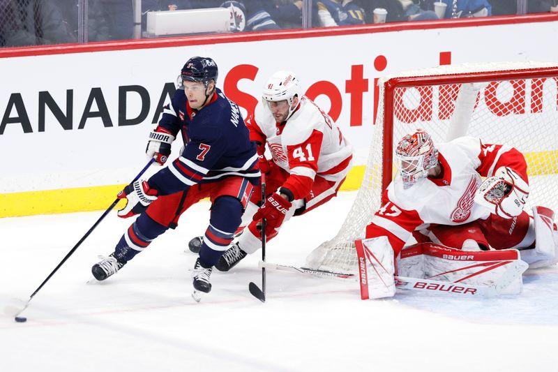 Dec 20, 2023; Winnipeg, Manitoba, CAN; Winnipeg Jets center Vladislav Namestnikov (7) is chased down by Detroit Red Wings defenseman Shayne Gostisbehere (41) in the third period at Canada Life Centre. Mandatory Credit: James Carey Lauder-USA TODAY Sports