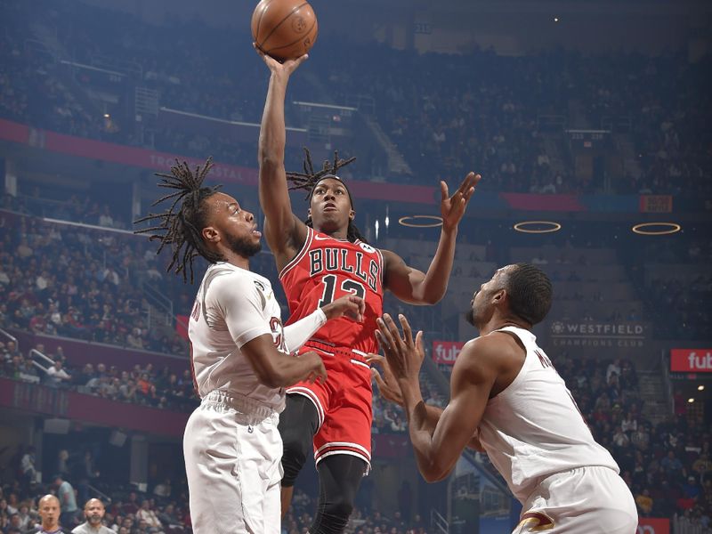 CLEVELAND, OH - FEBRUARY 11: Ayo Dosunmu #12 of the Chicago Bulls drives to the basket during the game against the Cleveland Cavaliers on February 11, 2023 at Rocket Mortgage FieldHouse in Cleveland, Ohio. NOTE TO USER: User expressly acknowledges and agrees that, by downloading and/or using this Photograph, user is consenting to the terms and conditions of the Getty Images License Agreement. Mandatory Copyright Notice: Copyright 2023 NBAE (Photo by David Liam Kyle/NBAE via Getty Images)