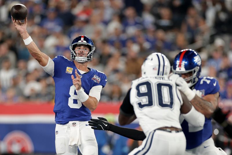 New York Giants quarterback Daniel Jones (8) passes against the Dallas Cowboys during the first quarter of an NFL football game, Thursday, Sept. 26, 2024, in East Rutherford, N.J. (AP Photo/Adam Hunger)