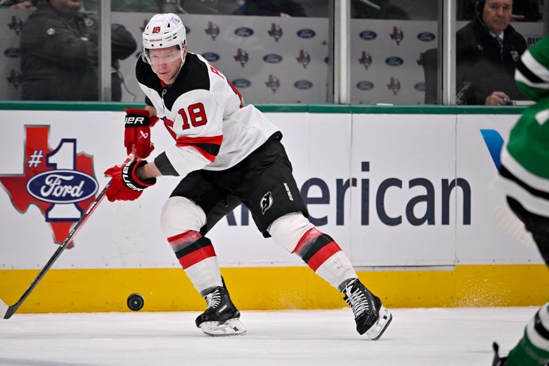 Mar 4, 2025; Dallas, Texas, USA; New Jersey Devils left wing Ondrej Palat (18) controls the puck during the first period against the Dallas Stars at the American Airlines Center. Mandatory Credit: Jerome Miron-Imagn Images