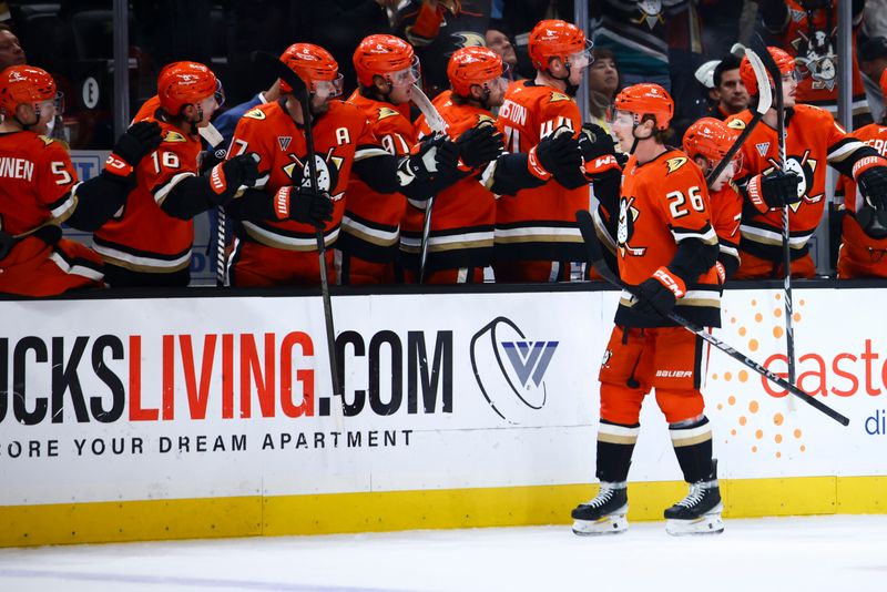 Nov 13, 2024; Anaheim, California, USA; Anaheim Ducks left wing Brock McGinn (26) celebrates with his teammates after scoring a goal against the Vegas Golden Knights during the first period of a hockey game at Honda Center. Mandatory Credit: Jessica Alcheh-Imagn Images