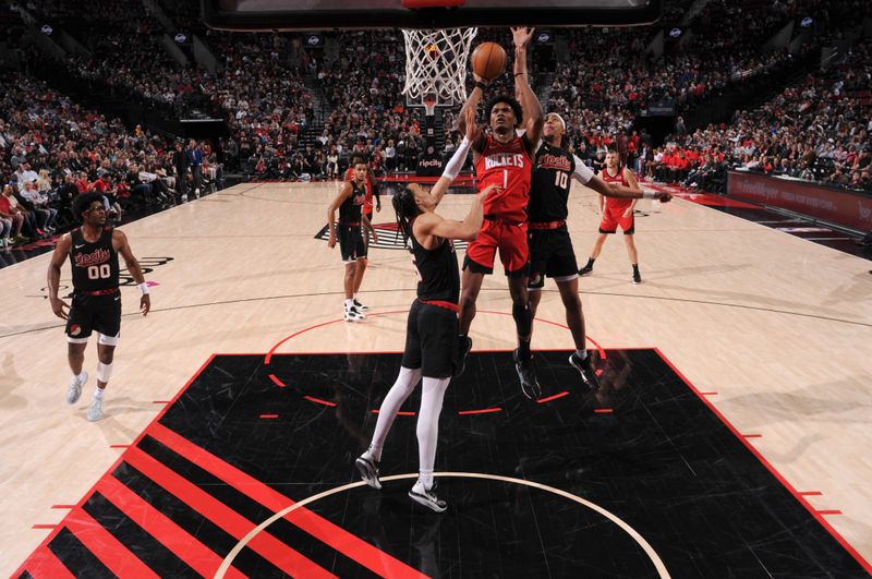 PORTLAND, OR - APRIL 12: Amen Thompson #1 of the Houston Rockets shoots the ball during the game against the Portland Trail Blazers on April 12, 2024 at the Moda Center Arena in Portland, Oregon. NOTE TO USER: User expressly acknowledges and agrees that, by downloading and or using this photograph, user is consenting to the terms and conditions of the Getty Images License Agreement. Mandatory Copyright Notice: Copyright 2024 NBAE (Photo by Cameron Browne/NBAE via Getty Images)