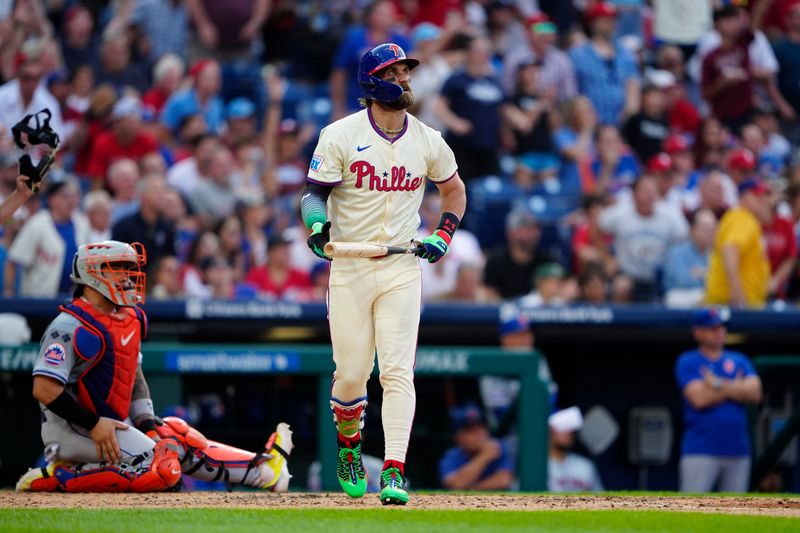 Sep 14, 2024; Philadelphia, Pennsylvania, USA; Philadelphia Phillies first baseman Bryce Harper (3) watches his second home run against the New York Mets during the sixth inning at Citizens Bank Park. Mandatory Credit: Gregory Fisher-Imagn Images