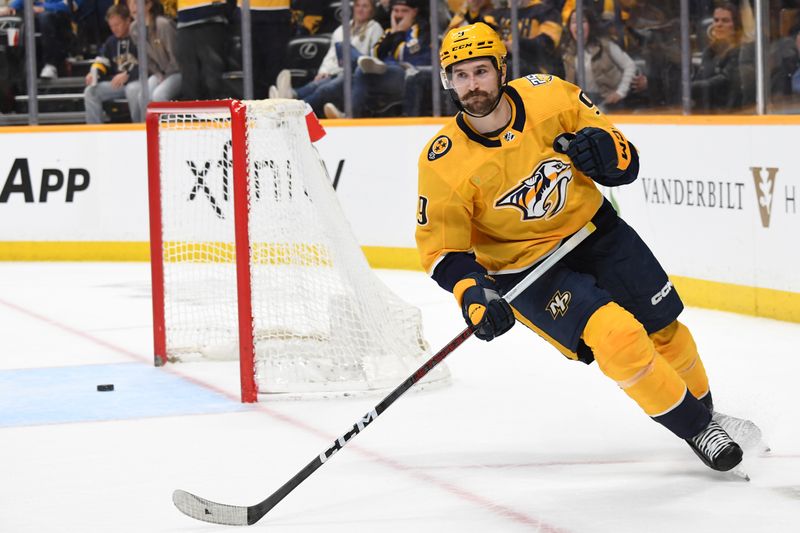 Apr 4, 2024; Nashville, Tennessee, USA; Nashville Predators left wing Filip Forsberg (9) celebrates after scoring an empty net goal during the third period against the St. Louis Blues at Bridgestone Arena. Mandatory Credit: Christopher Hanewinckel-USA TODAY Sports