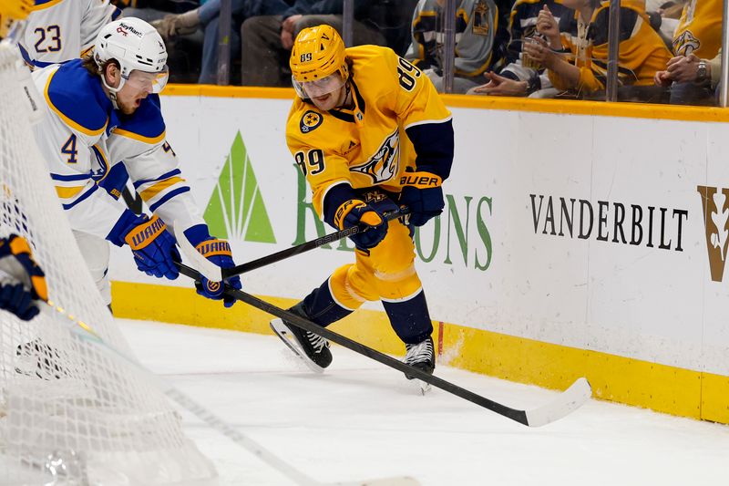 Jan 20, 2026; Nashville, Tennessee, USA;  Buffalo Sabres defenseman Bowen Byram (4) blocks the pass of Nashville Predators right wing Ozzy Weisblatt (89) during the third period at Bridgestone Arena. Mandatory Credit: Steve Roberts-Imagn Images