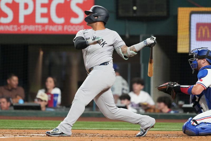 Sep 3, 2024; Arlington, Texas, USA; New York Yankees second baseman Gleyber Torres (25) follows through on his double against the Texas Rangers during the third inning at Globe Life Field. Mandatory Credit: Jim Cowsert-Imagn Images