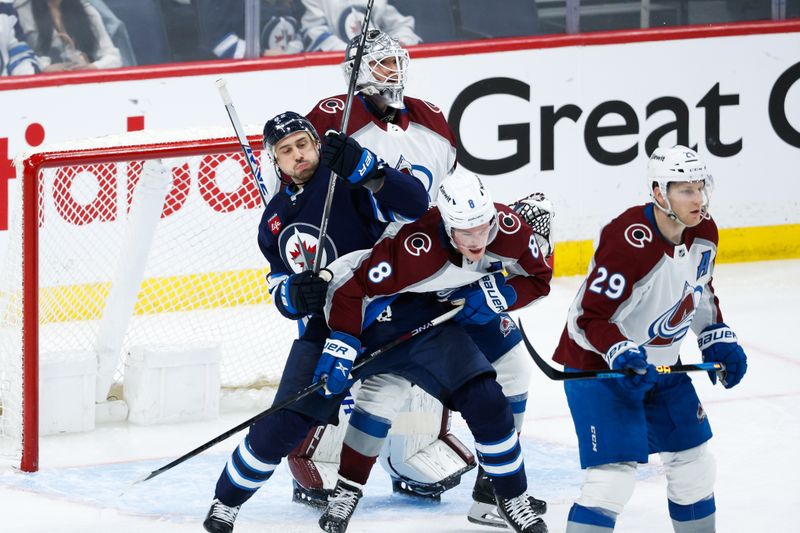 Apr 23, 2024; Winnipeg, Manitoba, CAN; Winnipeg Jets forward Nino Niederreiter (62) jostles for position with Colorado Avalanche defenseman Cale Makar (8) in front of  goalie Alexander Georgiev (40) during the third period in game two of the first round of the 2024 Stanley Cup Playoffs at Canada Life Centre. Mandatory Credit: Terrence Lee-USA TODAY Sports