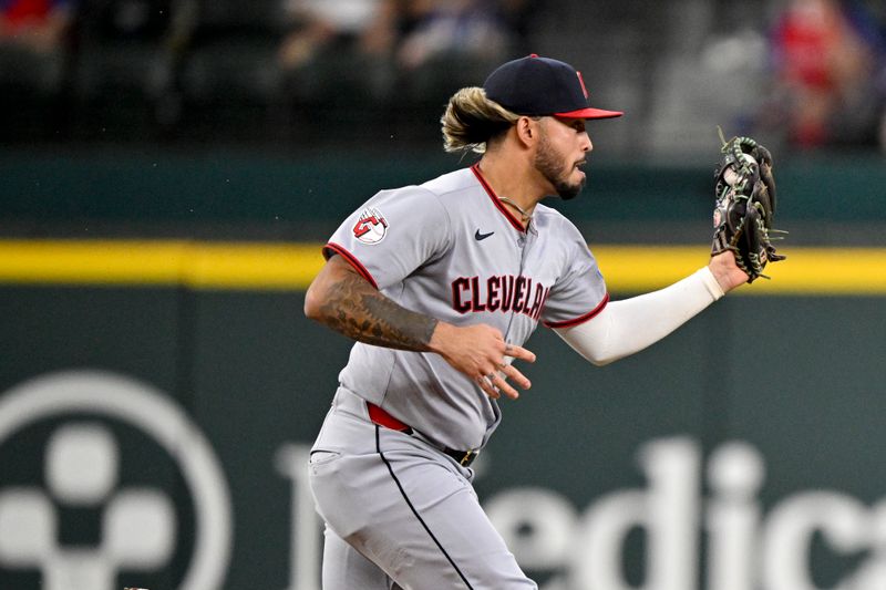 Aug 24, 2025; Arlington, Texas, USA; Cleveland Guardians shortstop Gabriel Arias (13) fields a ball hit by Texas Rangers right fielder Adolis Garcia (not pictured) during the second inning at Globe Life Field. Mandatory Credit: Jerome Miron-Imagn Images