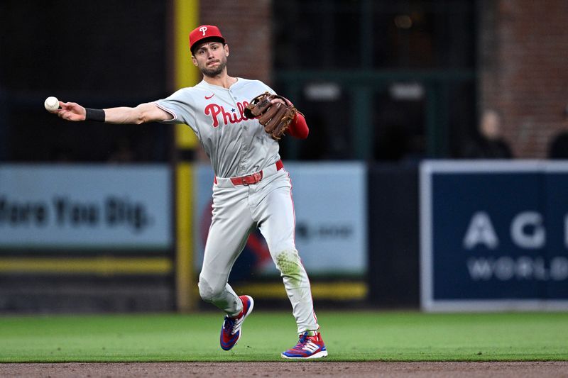 Apr 26, 2024; San Diego, California, USA; Philadelphia Phillies shortstop Trea Turner (7) throws to first base on a ground out by San Diego Padres third baseman Manny Machado (not pictured) during the third inning at Petco Park. Mandatory Credit: Orlando Ramirez-USA TODAY Sports