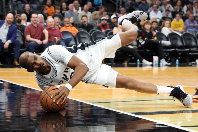 PHOENIX, ARIZONA - DECEMBER 03: Chris Paul #3 of the San Antonio Spurs attempts to control a loose ball during the second half of the Emirates NBA Cup game against the Phoenix Suns at Footprint Center on December 03, 2024 in Phoenix, Arizona. NOTE TO USER: User expressly acknowledges and agrees that, by downloading and or using this photograph, User is consenting to the terms and conditions of the Getty Images License Agreement.  (Photo by Chris Coduto/Getty Images)