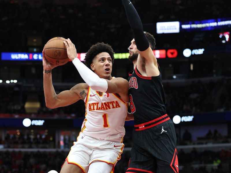 CHICAGO, ILLINOIS - NOVEMBER 22: Jalen Johnson #1 of the Atlanta Hawks dribbles to the hoop against Zach LaVine #8 of the Chicago Bulls during the second quarter of the Emirates NBA Cup at the United Center on November 22, 2024 in Chicago, Illinois. NOTE TO USER: User expressly acknowledges and agrees that, by downloading and or using this photograph, User is consenting to the terms and conditions of the Getty Images License Agreement. (Photo by Geoff Stellfox/Getty Images)