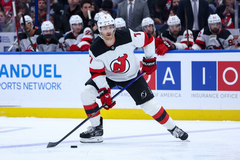 Nov 16, 2024; Tampa, Florida, USA; New Jersey Devils defenseman Dougie Hamilton (7) controls the puck against the Tampa Bay Lightning in the second period at Amalie Arena. Mandatory Credit: Nathan Ray Seebeck-Imagn Images