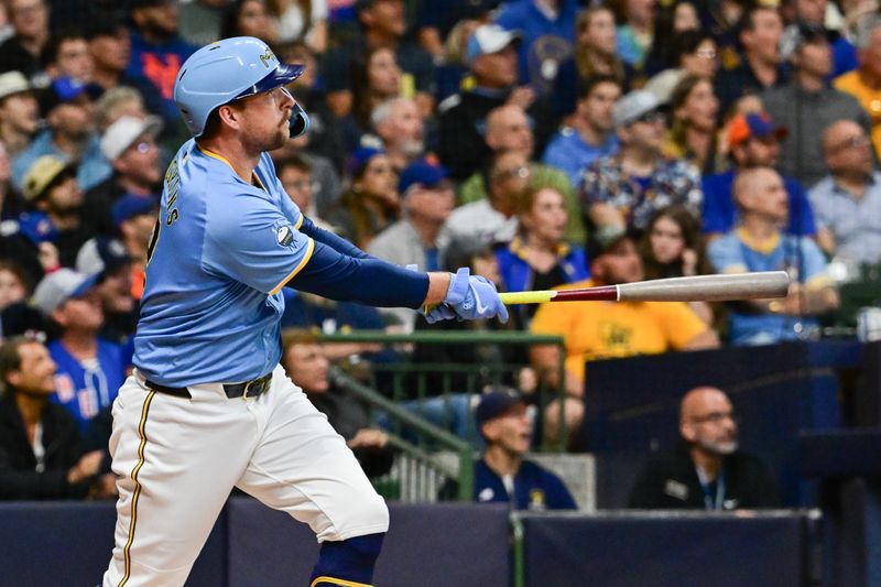 Sep 27, 2024; Milwaukee, Wisconsin, USA;  Milwaukee Brewers first baseman Rhys Hoskins (12) watches after hitting a grand slam home run against the New York Mets in the first inning at American Family Field. Mandatory Credit: Benny Sieu-Imagn Images