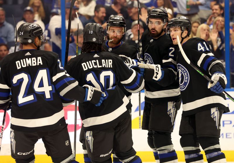 Apr 17, 2024; Tampa, Florida, USA; Tampa Bay Lightning left wing Nicholas Paul (20) is congratulated by defenseman Calvin de Haan (44), defenseman Matt Dumba (24), left wing Anthony Duclair (10) and right wing Mitchell Chaffee (41) after scoring against the Toronto Maple Leafs during the first period at Amalie Arena. Mandatory Credit: Kim Klement Neitzel-USA TODAY Sports